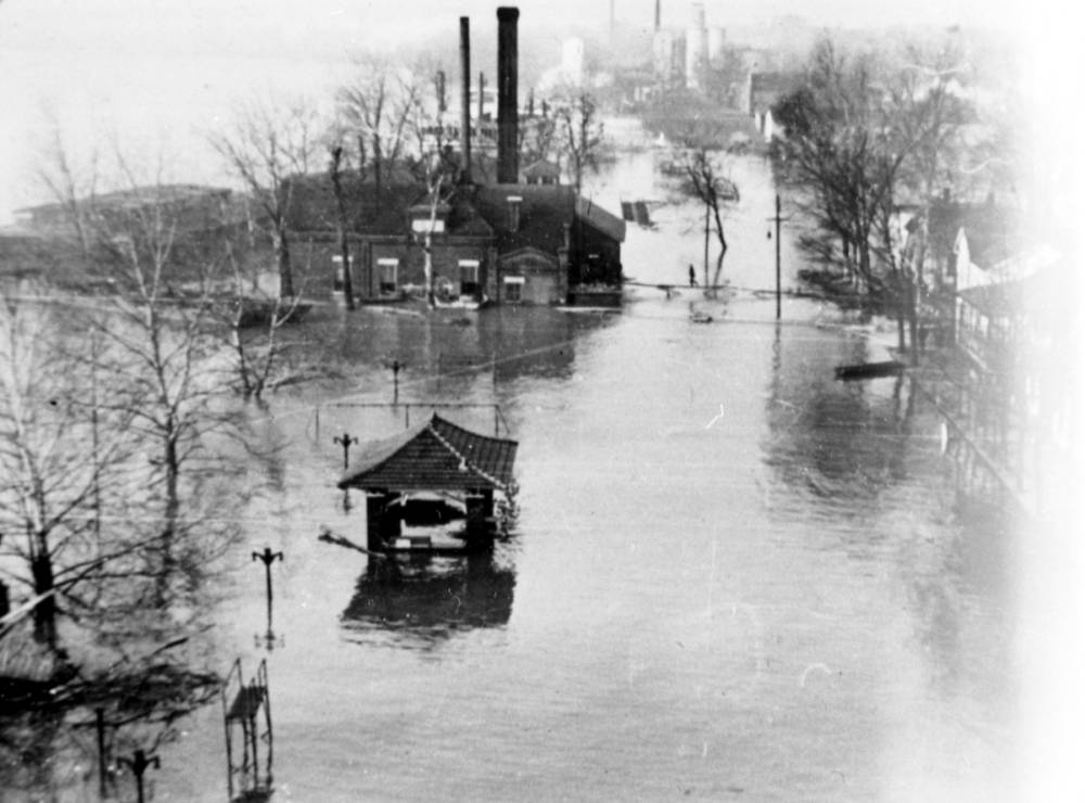 Sherburne Park at 151 West Water Street, Mt Vernon, IN bandstand under water. Barge and steamboat in background, 1937. Source: UASC, MSS 272-0251.